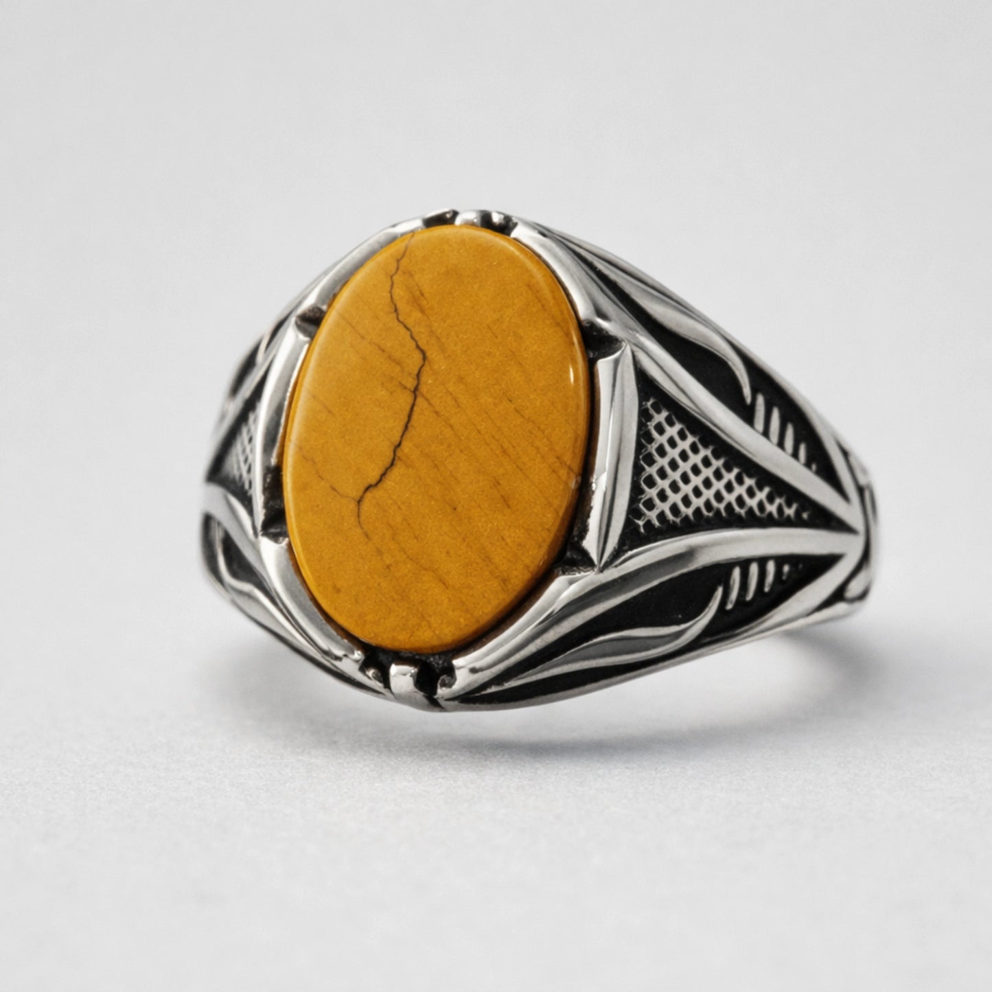 Men’s 925 sterling silver ring with golden oval stone and geometric engraved band design