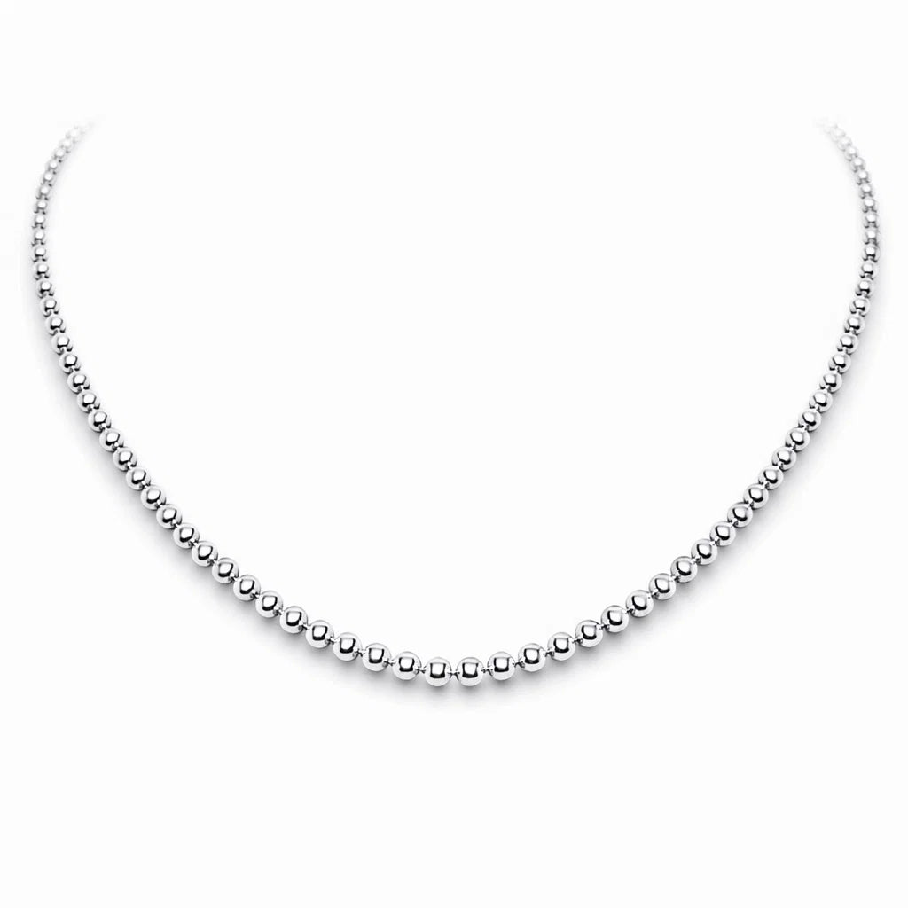 Silver beaded necklace on a white background