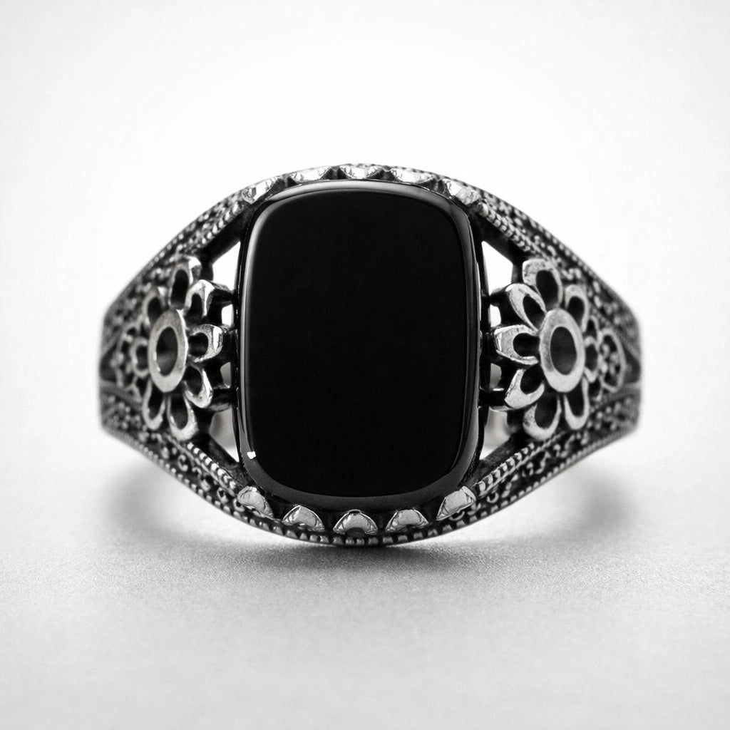 Men’s 925 sterling silver ring with smooth midnight black stone and floral crest side detailing