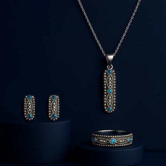 Women's 925 silver jewelry set from UAE brand. Includes an oxidized silver ring, stud earrings, and bar pendant, all featuring blue Zircon stones and vintage beaded metalwork.