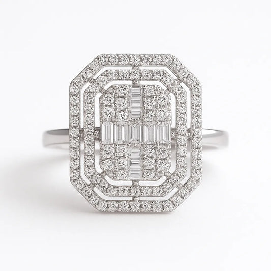 Diamond ring with a central emerald-cut gemstone and smaller diamonds on a white background