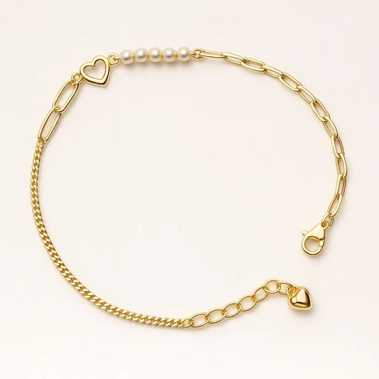 Gold bracelet with heart-shaped charms on a white background