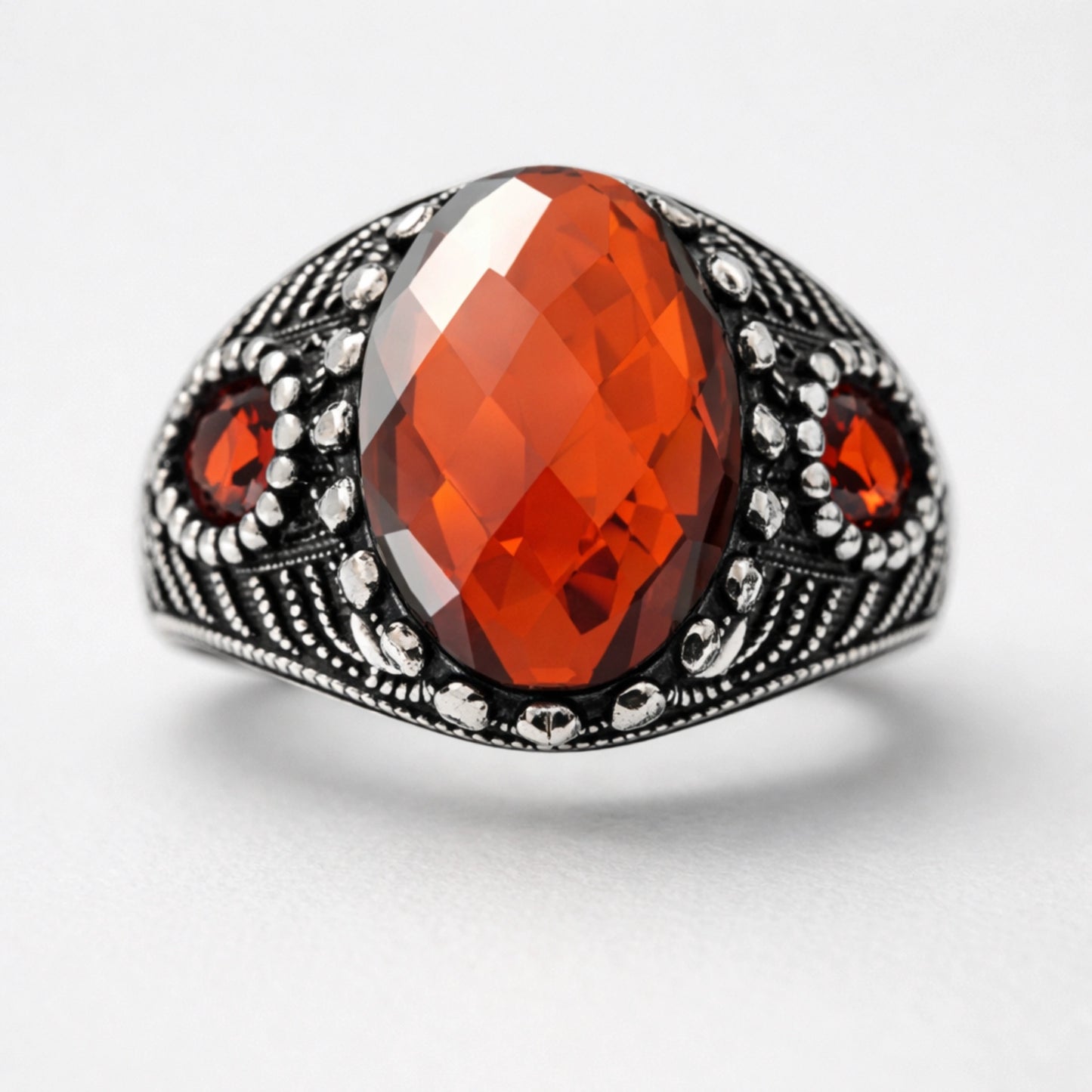 Men’s 925 sterling silver ring with oval faceted deep red gemstone and vintage detailing