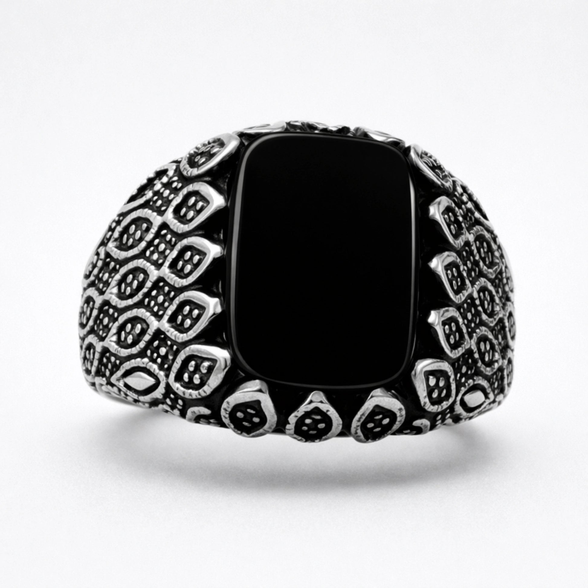 Men’s 925 sterling silver ring with glossy black rectangular stone and textured armor-style band