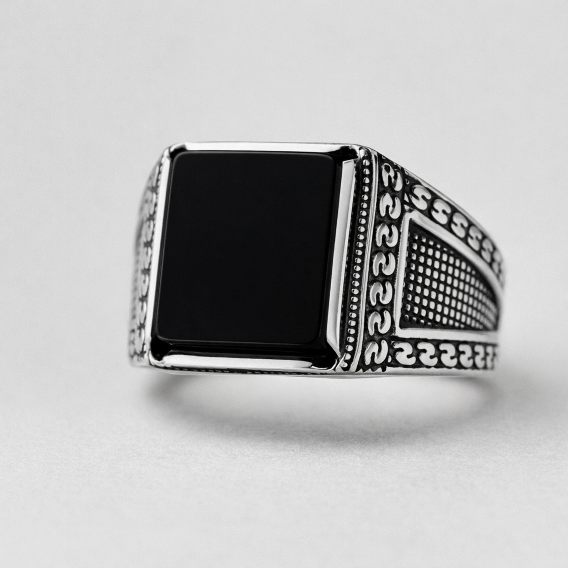 Men’s 925 sterling silver square signet ring with glossy jet-black stone and textured patterned band