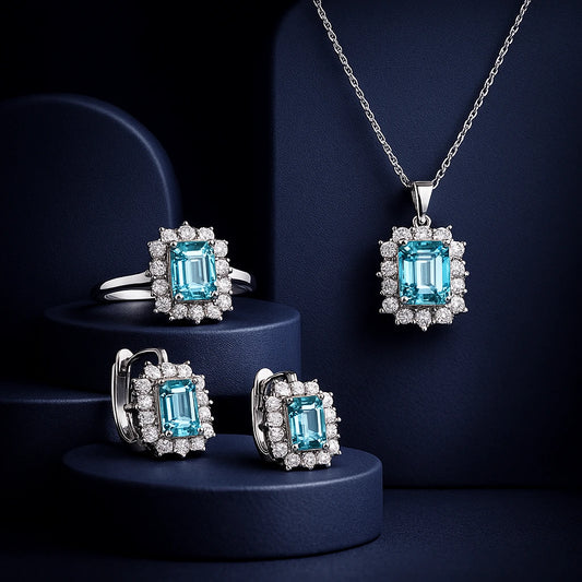 Jewelry set with blue gemstones and silver accents on a dark background