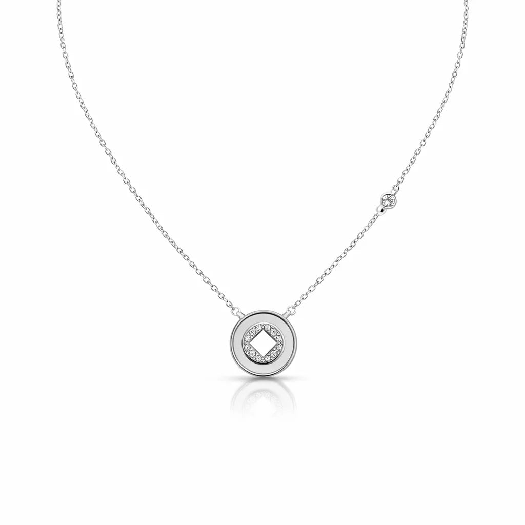 Silver necklace with a round pendant on a white background