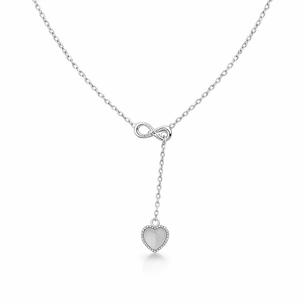 Silver necklace with a heart-shaped pendant on a white background