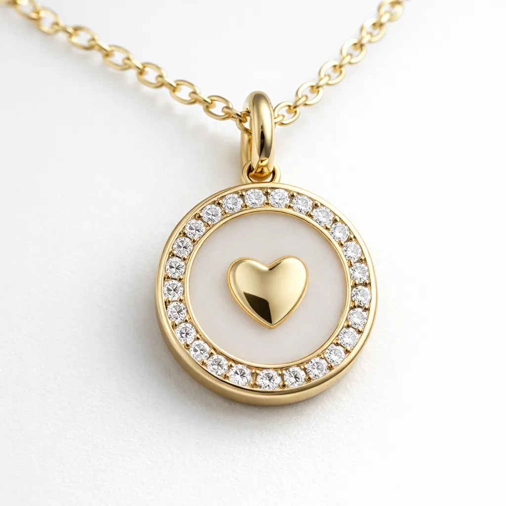 Gold necklace with a heart pendant on a white background