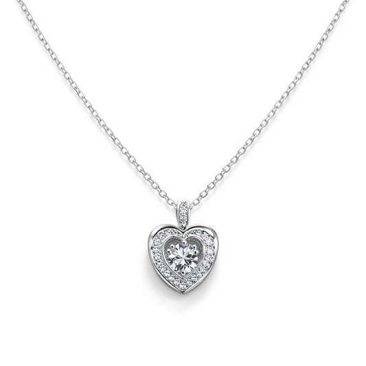Heart-shaped diamond pendant on a chain against a white background